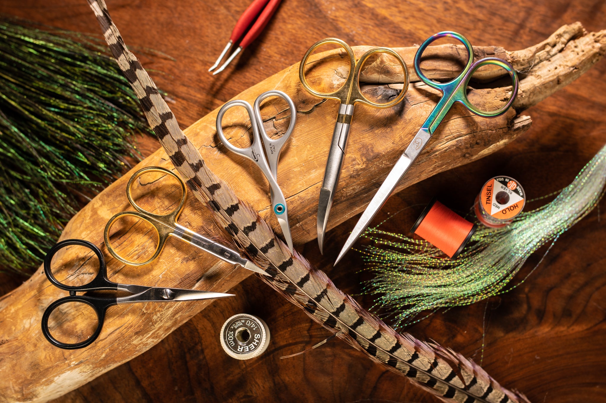 Scissors and thread on a wooden surface with a rustic background
