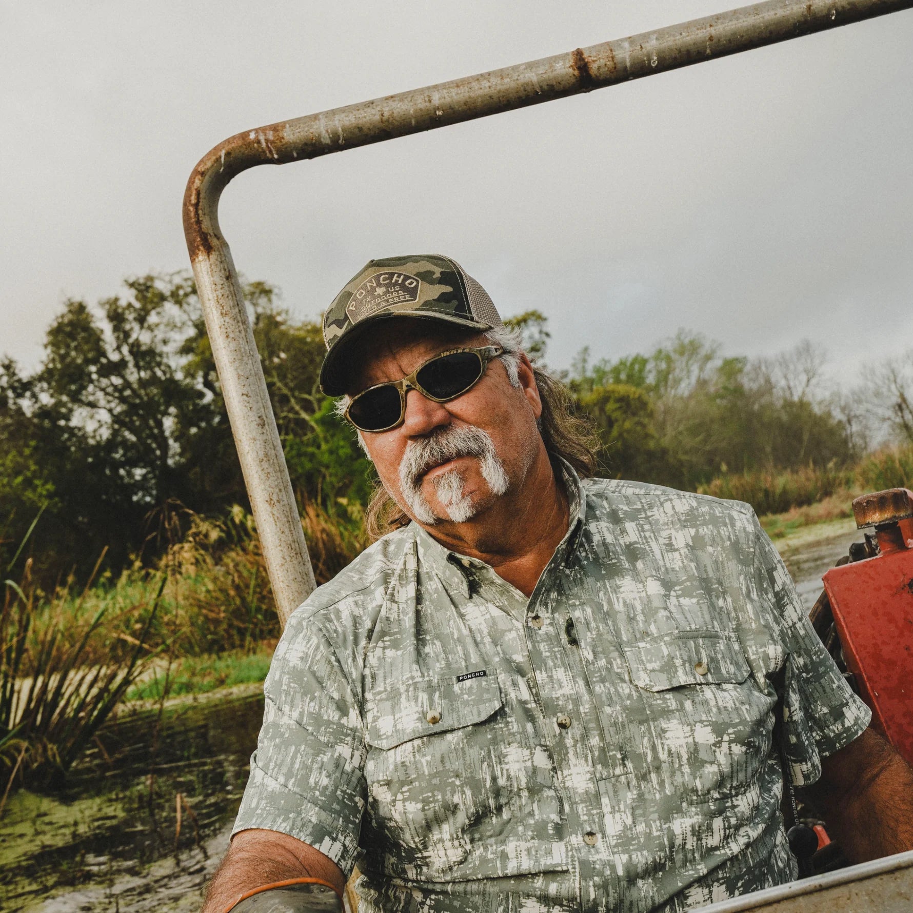 Poncho Outdoors Camo Wild and Free Trucker Hat